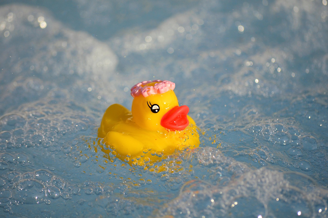 rubber duck, hot tub, swimming pool, bath toy, water, foam, air bubbles, squeaky duck, bath duck, rubber ducks, swim, bathing fun, cute, summer, pool, vacations, vacation, tied